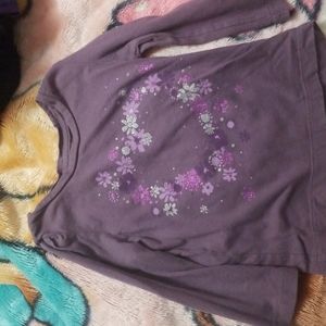 A size 12_18 toddler purple shirt